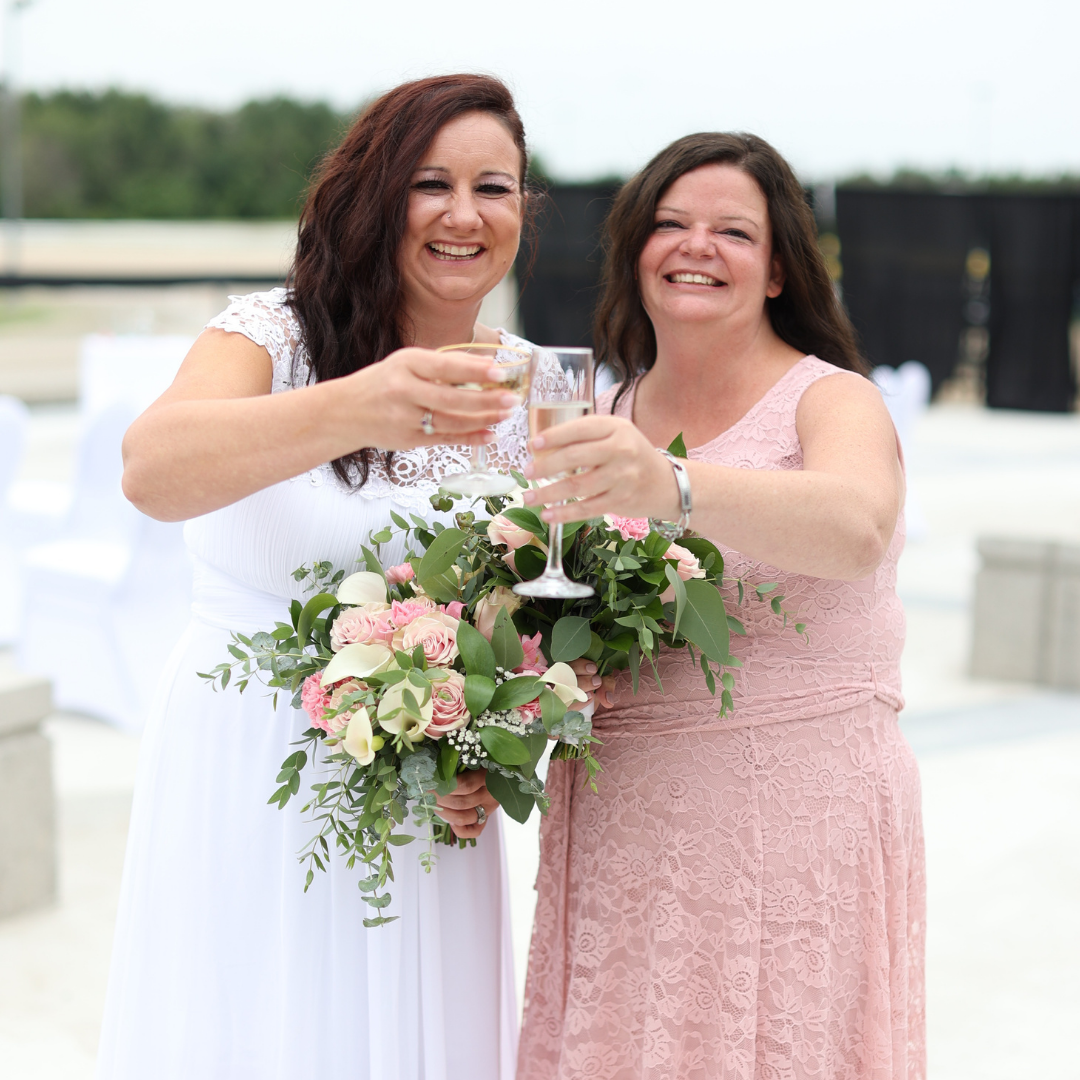 two women cheersing champagne