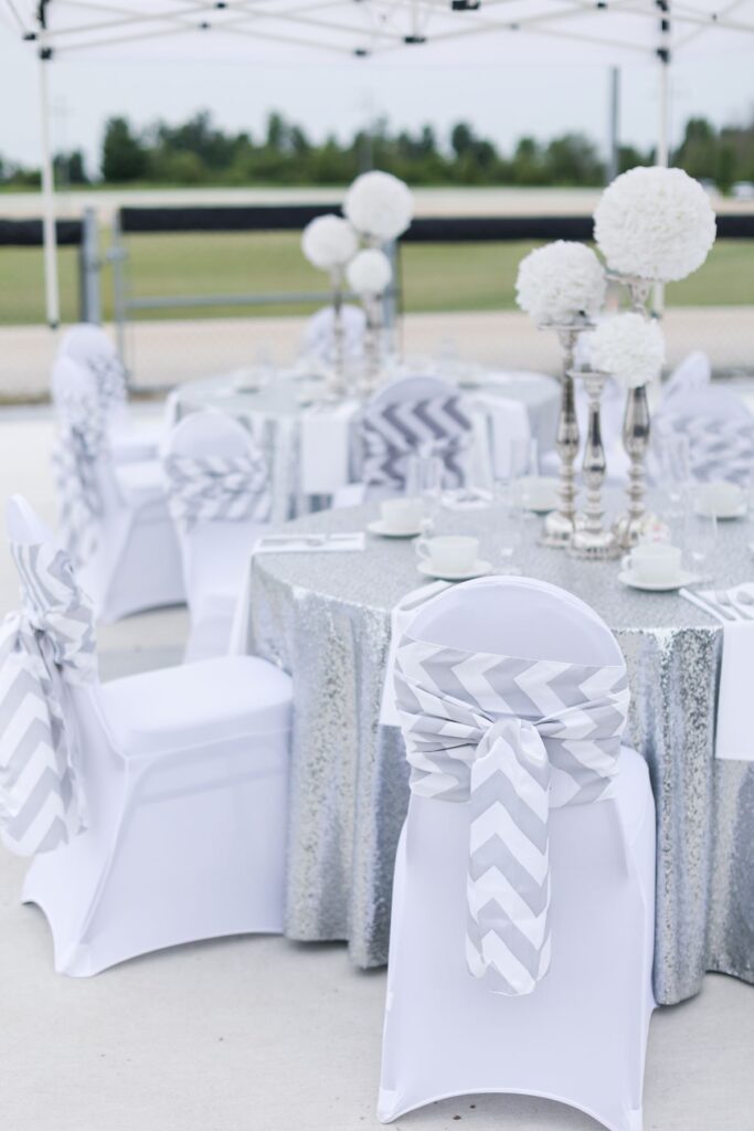 outdoor patio dinner set up with silver and white