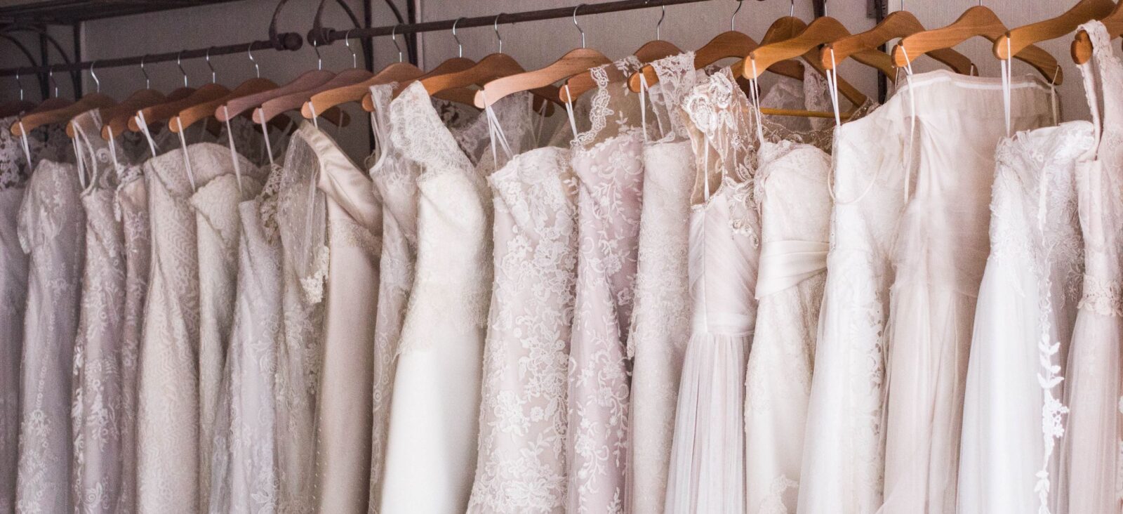 wedding dress hung on hangers