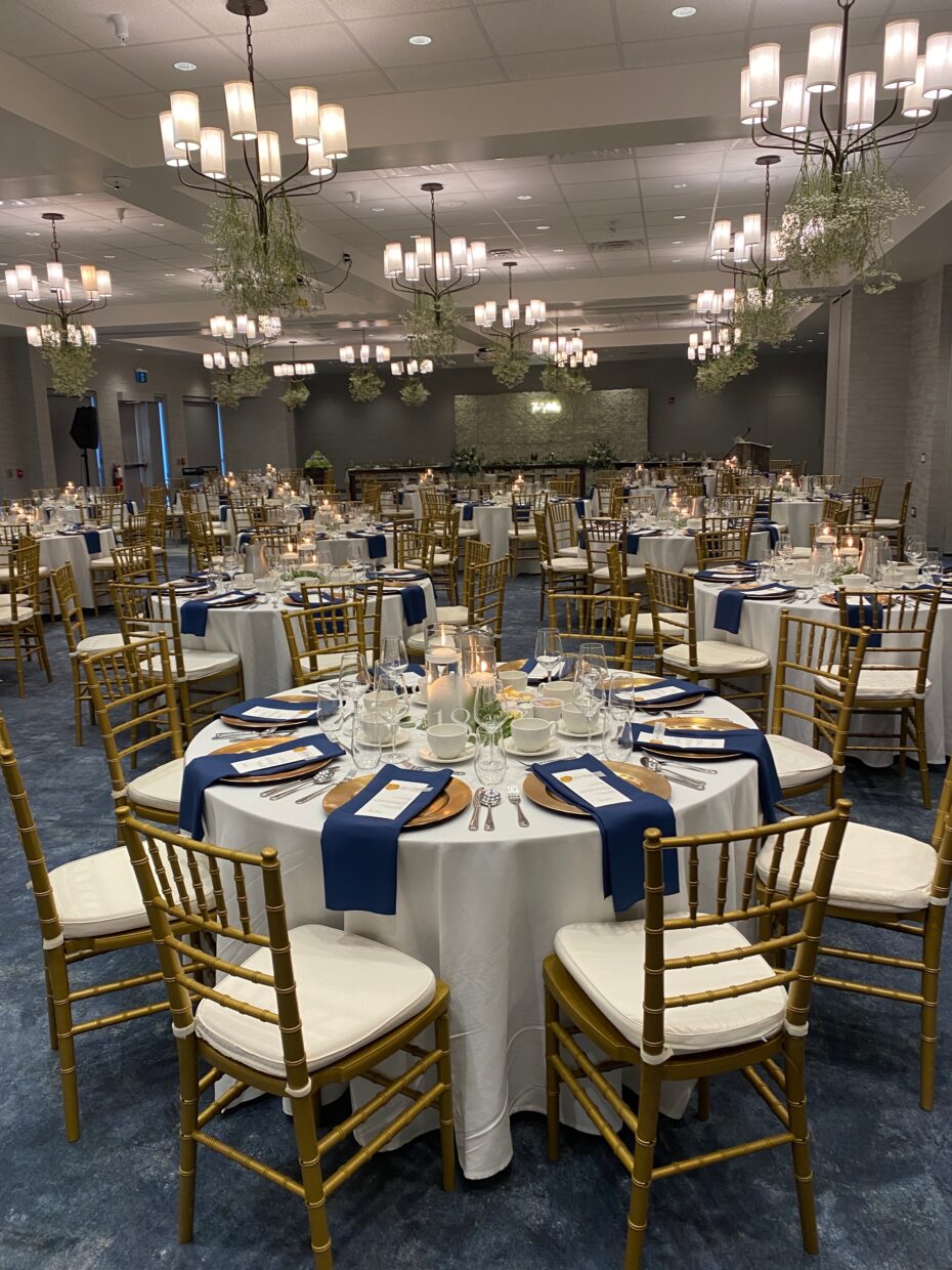gold chairs and blue linens room set up