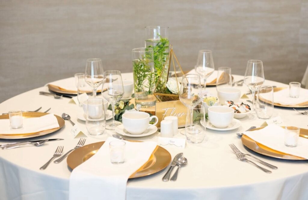 gold, white and green table setting