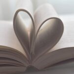 open book with pages forming a heart