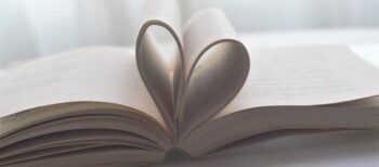 open book with pages forming a heart