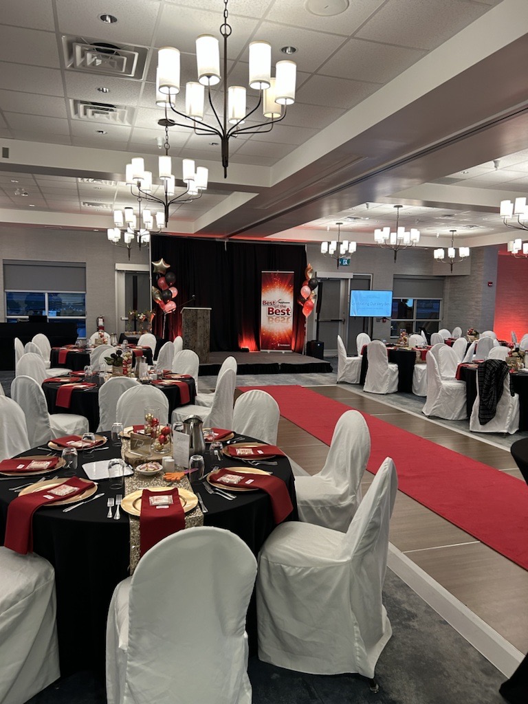 Red and gold decor with red carpet leading towards stage